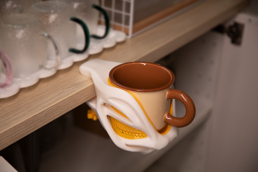 Several glass measuring cups on the kitchen counter, propped up on a stylish stand